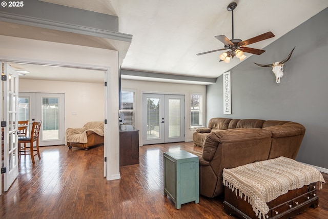 living area featuring dark wood-style floors, vaulted ceiling, french doors, and a ceiling fan