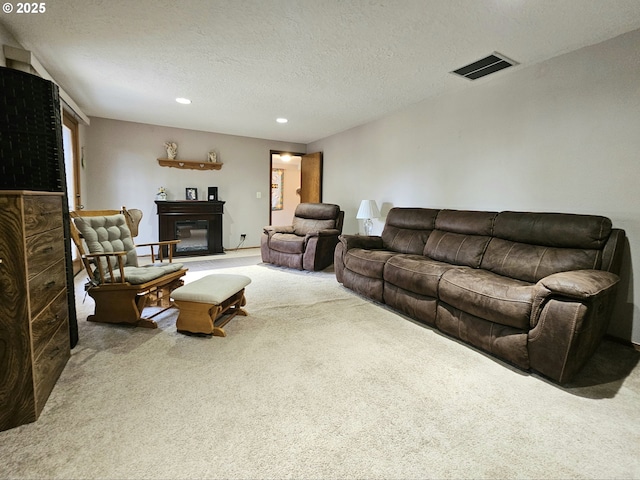 288 N Dorcas Dr, Keizer, OR 97303 - living area featuring carpet flooring, recessed lighting, a textured ceiling, and a glass covered fireplace