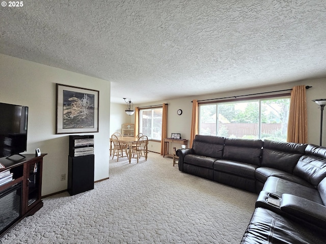 288 N Dorcas Dr, Keizer, OR 97303 - living room with light carpet, plenty of natural light, and a textured ceiling