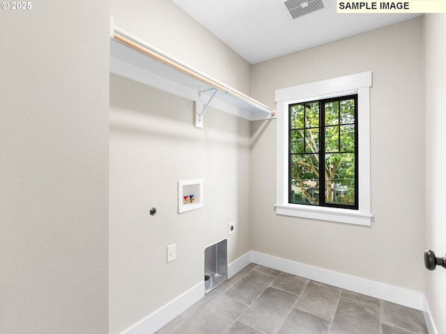 washroom with hookup for a washing machine and hookup for an electric dryer