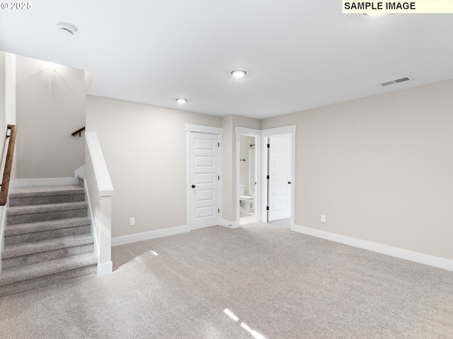 unfurnished room featuring carpet flooring