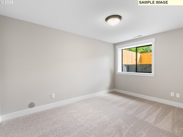 unfurnished room featuring carpet flooring