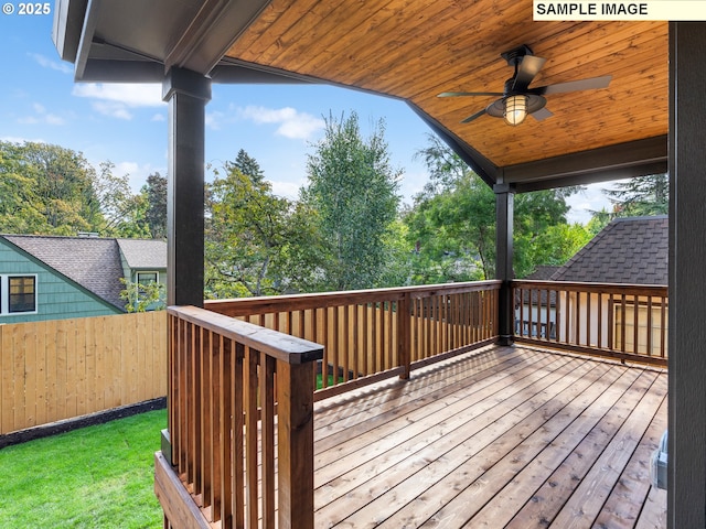 wooden terrace featuring ceiling fan