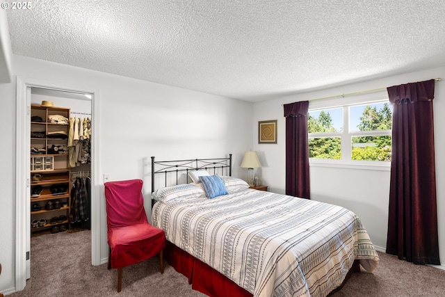7735 Harpole St, Salem, OR 97317 - bedroom featuring a textured ceiling, a walk in closet, carpet, and a closet