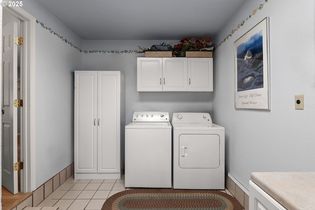 7735 Harpole St, Salem, OR 97317 - washroom with cabinet space, light tile patterned floors, and washing machine and dryer