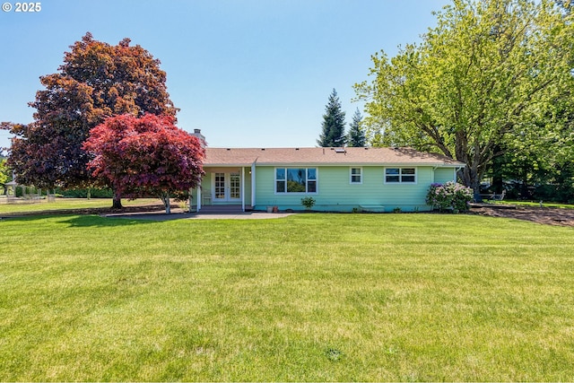 7735 Harpole St, Salem, OR 97317 - rear view of house with french doors, a yard, and a chimney