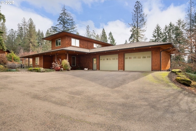 view of front of house with an attached garage and driveway