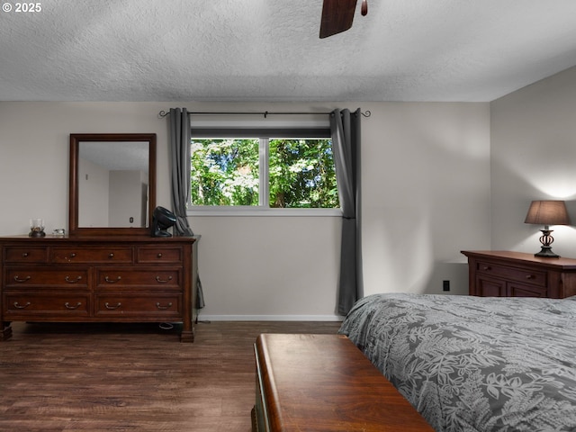 17222 SE Tickle Creek Rd, Boring, OR 97009 - bedroom featuring dark wood-type flooring, a textured ceiling, baseboards, and ceiling fan
