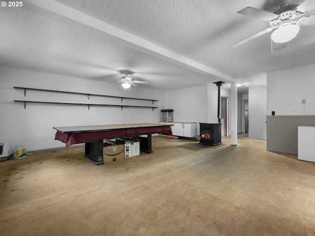 17222 SE Tickle Creek Rd, Boring, OR 97009 - rec room featuring concrete flooring, ceiling fan, a textured ceiling, billiards, and a wood stove