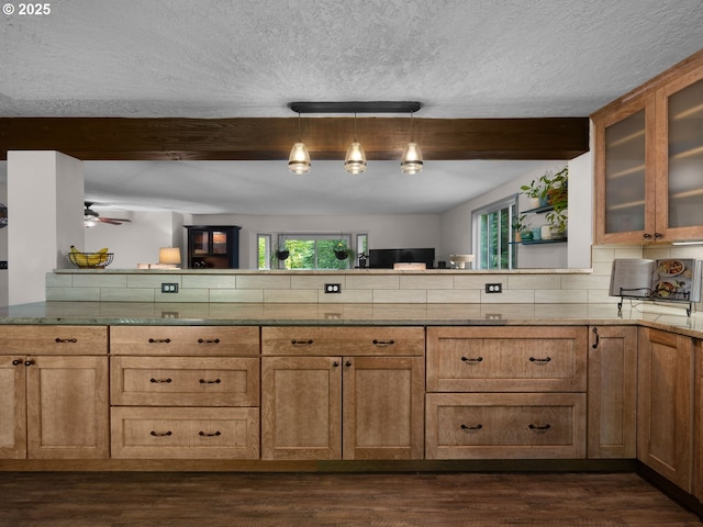 17222 SE Tickle Creek Rd, Boring, OR 97009 - kitchen featuring plenty of natural light, a peninsula, beamed ceiling, a textured ceiling, and dark wood-style flooring