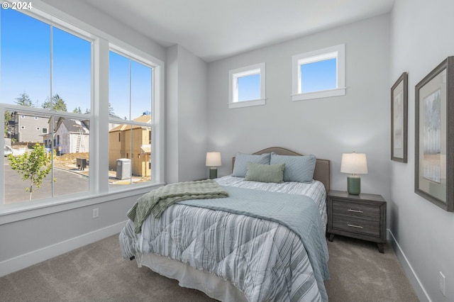 bedroom with carpet flooring and baseboards