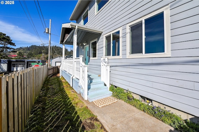 view of side of home with fence