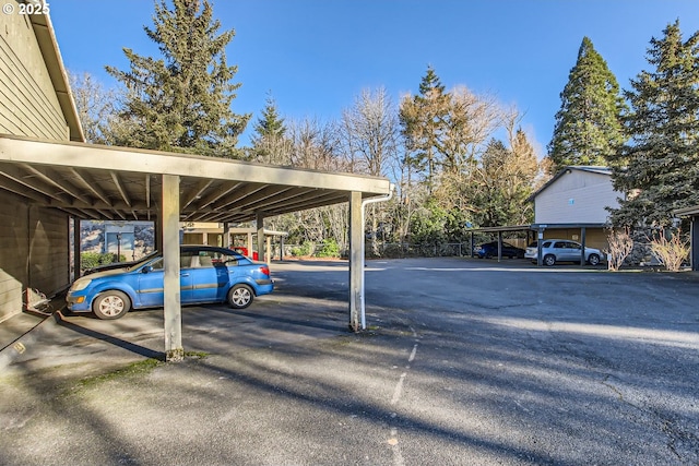 view of vehicle parking featuring a carport