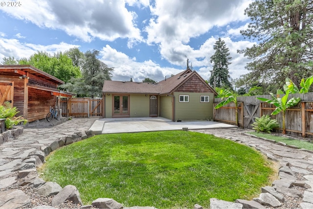 16510 SE Gordon St, Milwaukie, OR 97267 - rear view of property with a patio, a fenced backyard, and french doors