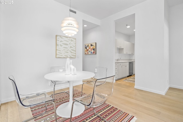 618 NW 12th Ave, Portland, OR 97209 - dining space featuring light wood-style floors and recessed lighting
