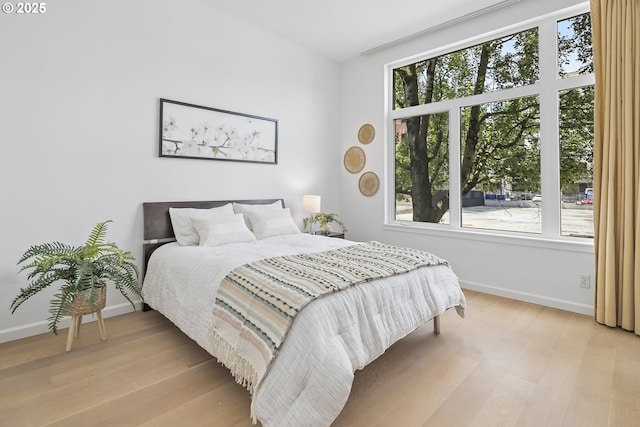 618 NW 12th Ave, Portland, OR 97209 - bedroom with multiple windows and light wood-type flooring