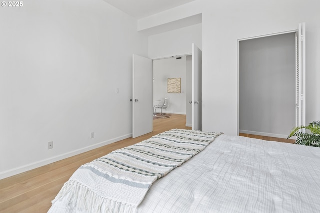 618 NW 12th Ave, Portland, OR 97209 - bedroom featuring wood finished floors and baseboards
