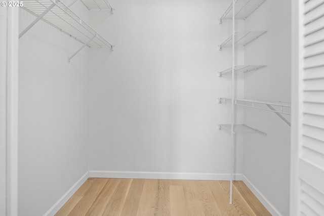 618 NW 12th Ave, Portland, OR 97209 - walk in closet with light wood-style flooring