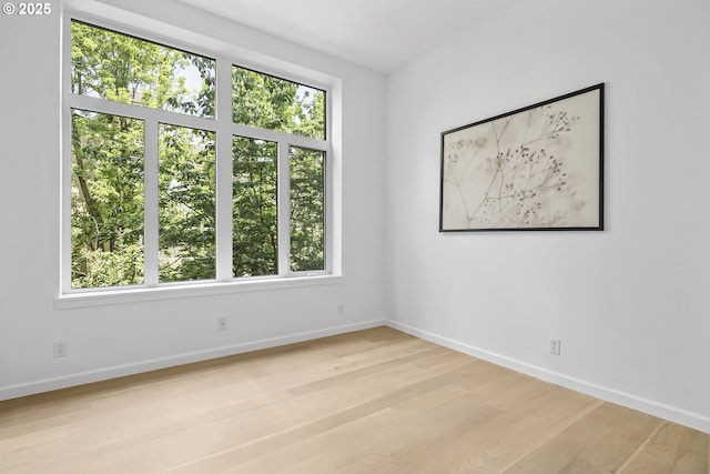 618 NW 12th Ave, Portland, OR 97209 - empty room featuring light wood-style flooring and healthy amount of natural light