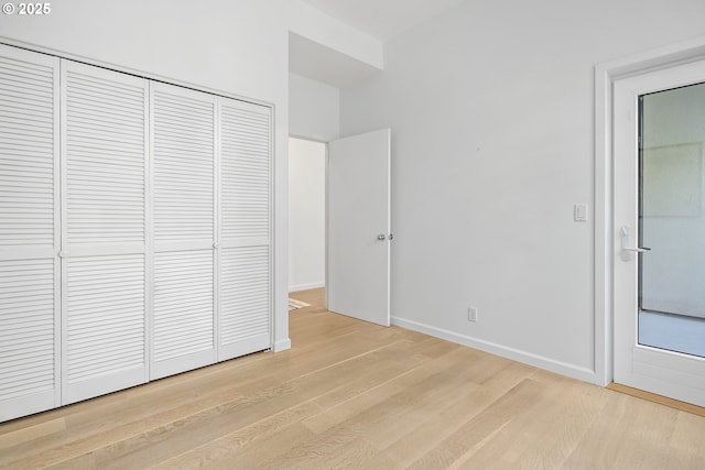 618 NW 12th Ave, Portland, OR 97209 - unfurnished bedroom featuring wood finished floors and a closet