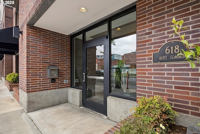 618 NW 12th Ave, Portland, OR 97209 - doorway to property featuring brick siding
