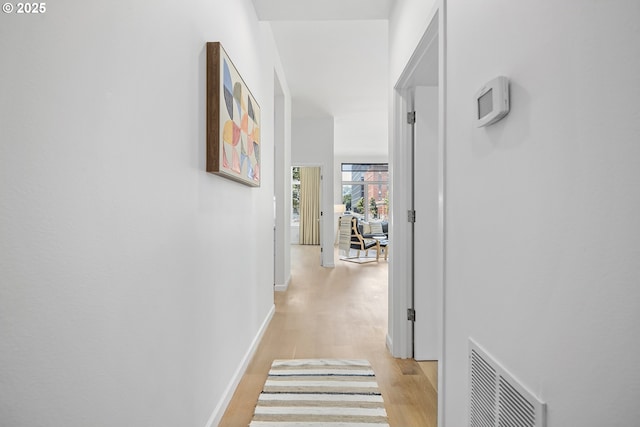 618 NW 12th Ave, Portland, OR 97209 - corridor featuring light wood-type flooring and baseboards