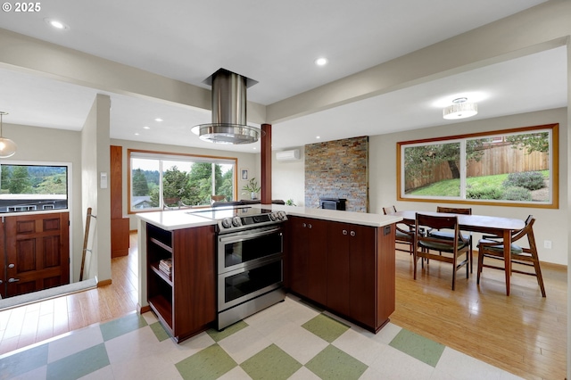 3765 Potter St, Eugene, OR 97405 - kitchen featuring double oven range, light countertops, open shelves, a wall mounted AC, and recessed lighting
