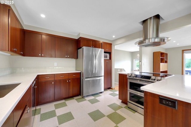 3765 Potter St, Eugene, OR 97405 - kitchen featuring stainless steel appliances, light floors, light countertops, island range hood, and recessed lighting