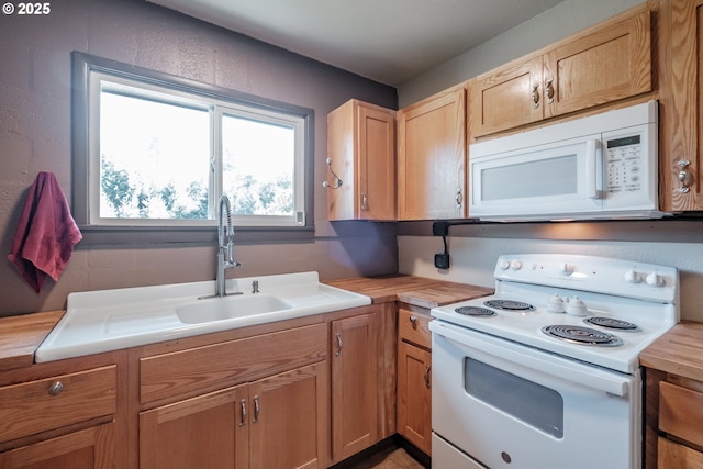 9602 Harlan Rd, Eddyville, OR 97343 - kitchen with white appliances and butcher block countertops