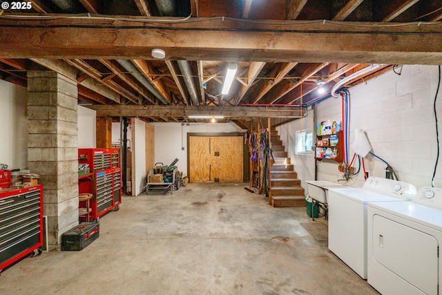 9602 Harlan Rd, Eddyville, OR 97343 - below grade area featuring stairs, separate washer and dryer, and a sink