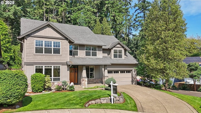 12955 SW Oxalis Ter, Portland, OR 97223 - view of front of property with driveway, stone siding, and roof with shingles