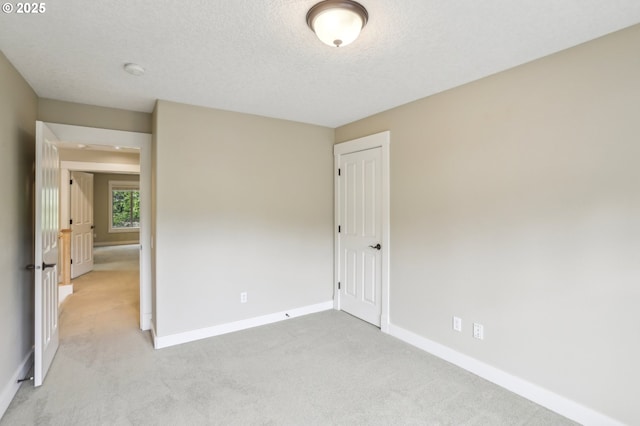 12955 SW Oxalis Ter, Portland, OR 97223 - unfurnished room featuring light carpet and a textured ceiling