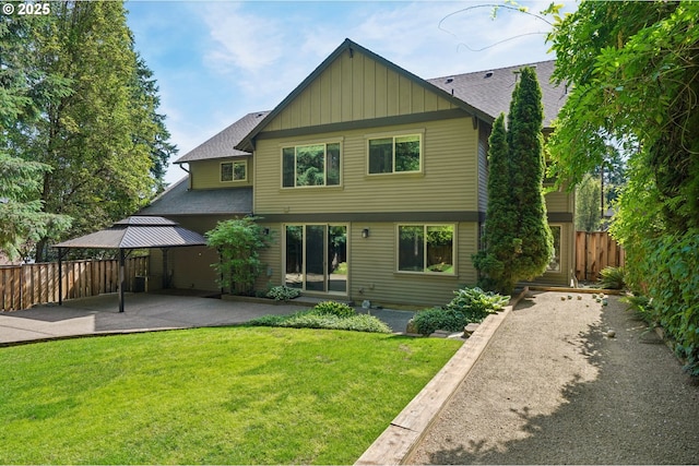 12955 SW Oxalis Ter, Portland, OR 97223 - rear view of property featuring a patio, board and batten siding, a gazebo, and roof with shingles