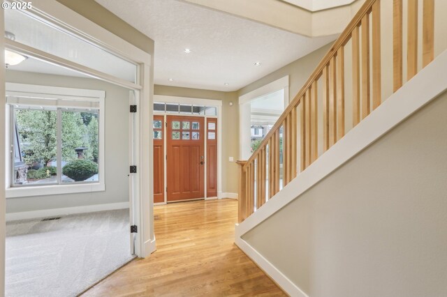 12955 SW Oxalis Ter, Portland, OR 97223 - foyer entrance featuring stairs, recessed lighting, and light wood-type flooring