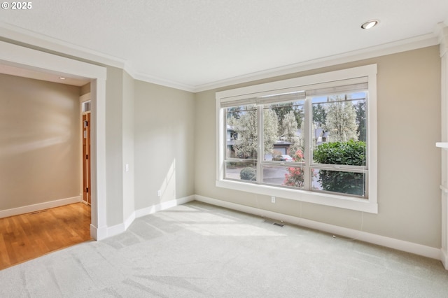12955 SW Oxalis Ter, Portland, OR 97223 - spare room with ornamental molding, carpet, and recessed lighting