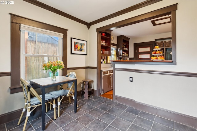 1206 NE 74th Ave, Portland, OR 97213 - dining room featuring baseboards, dark tile patterned flooring, ornamental molding, and a bar