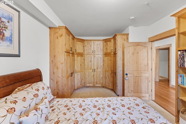 bedroom featuring light colored carpet