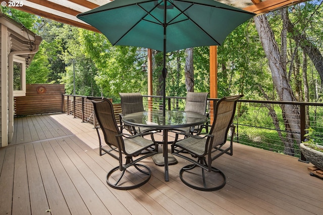 wooden deck with outdoor dining area