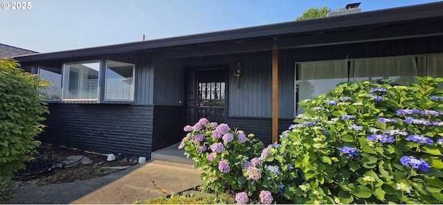 14128 NE Rose Pkwy, Portland, OR 97230 - view of exterior entry with covered porch and brick siding