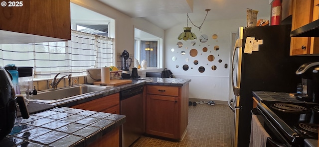 14128 NE Rose Pkwy, Portland, OR 97230 - kitchen featuring dishwasher, a peninsula, tile counters, dark colored carpet, and healthy amount of natural light