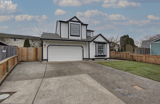 view of front facade with a front yard and a garage