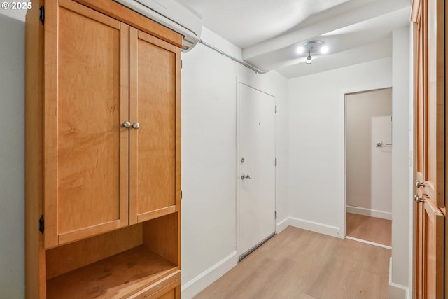 1205 SW Cardinell Dr Unit 604, Portland, OR 97201 - hallway featuring light wood finished floors and baseboards