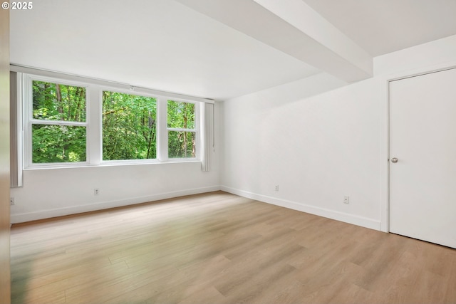 1205 SW Cardinell Dr Unit 604, Portland, OR 97201 - unfurnished room featuring light wood-type flooring and baseboards