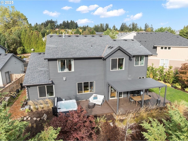 back of property featuring a patio, roof with shingles, fence, and a residential view