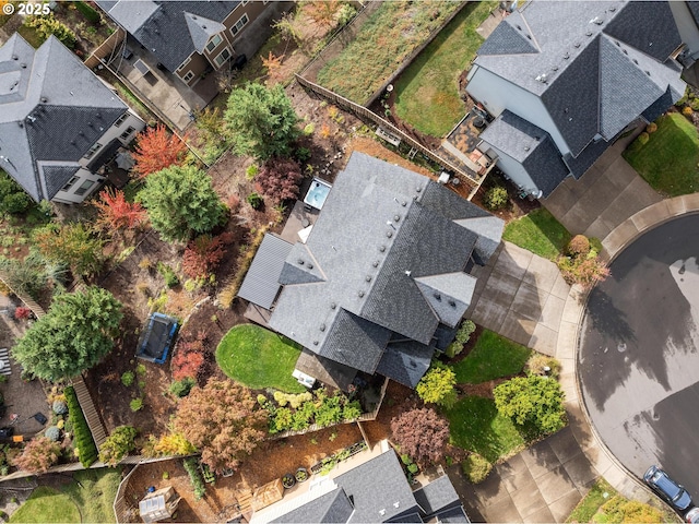 birds eye view of property with a residential view