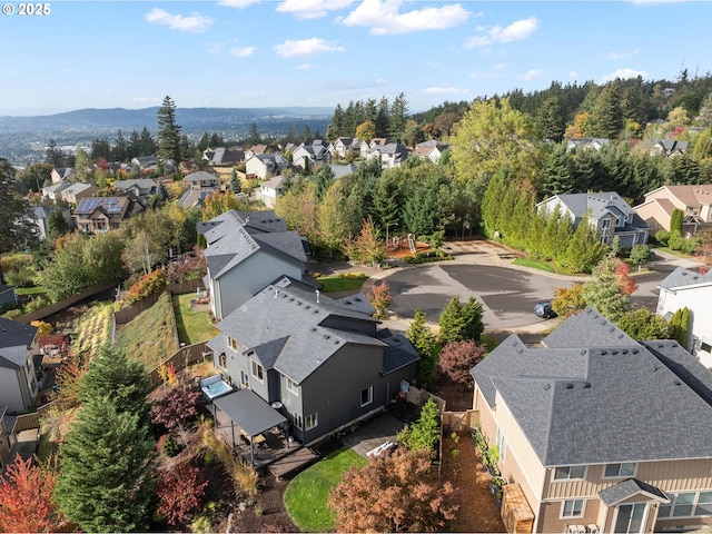 birds eye view of property with a residential view