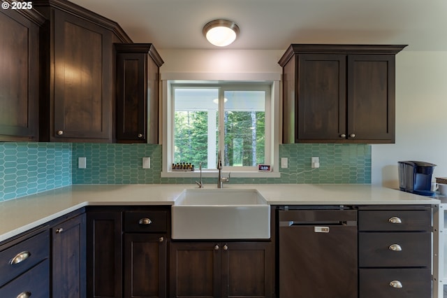 510 SE 130th Dr, Newport, OR 97366 - kitchen featuring stainless steel dishwasher, dark brown cabinetry, light countertops, and decorative backsplash