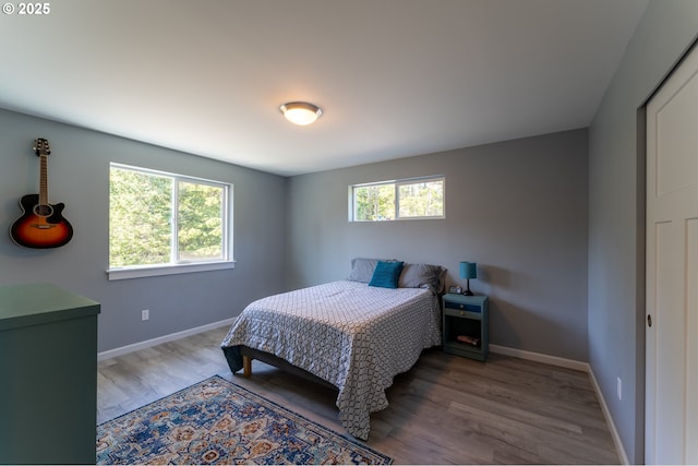 510 SE 130th Dr, Newport, OR 97366 - bedroom featuring wood finished floors and baseboards