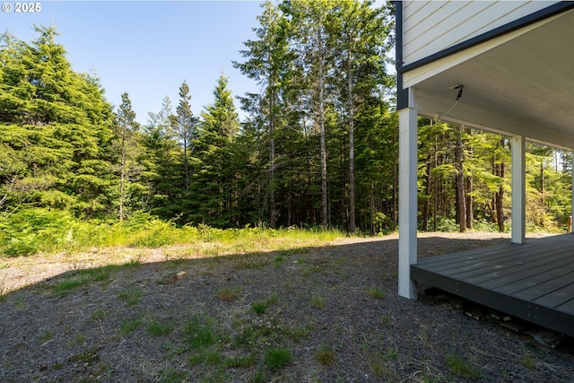 510 SE 130th Dr, Newport, OR 97366 - view of yard with a wooden deck and a forest view