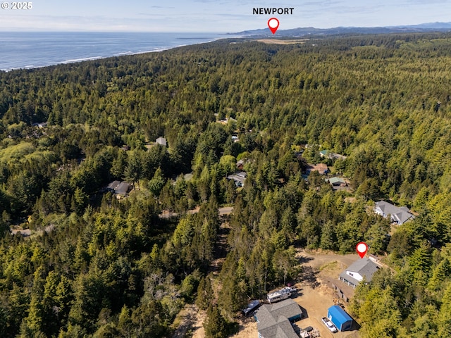510 SE 130th Dr, Newport, OR 97366 - aerial overview of property's location with a heavily wooded area